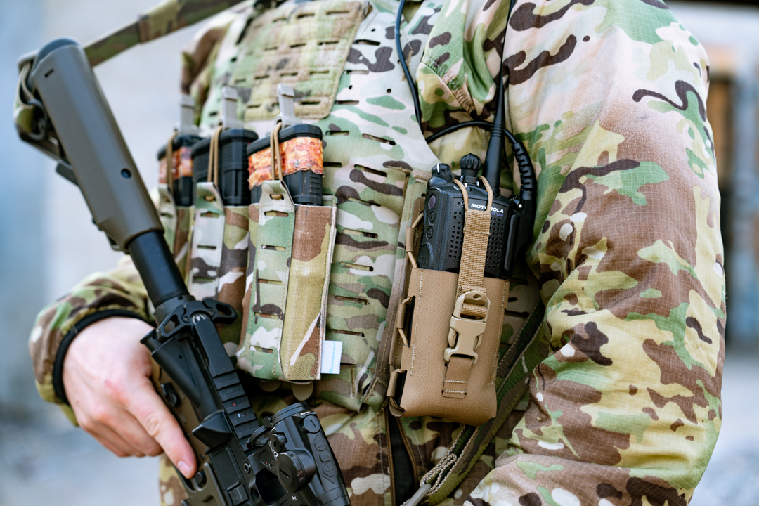 data-element= XTS Radio in a MOLLE Pouch on a Plate Carrier Load Carriage system